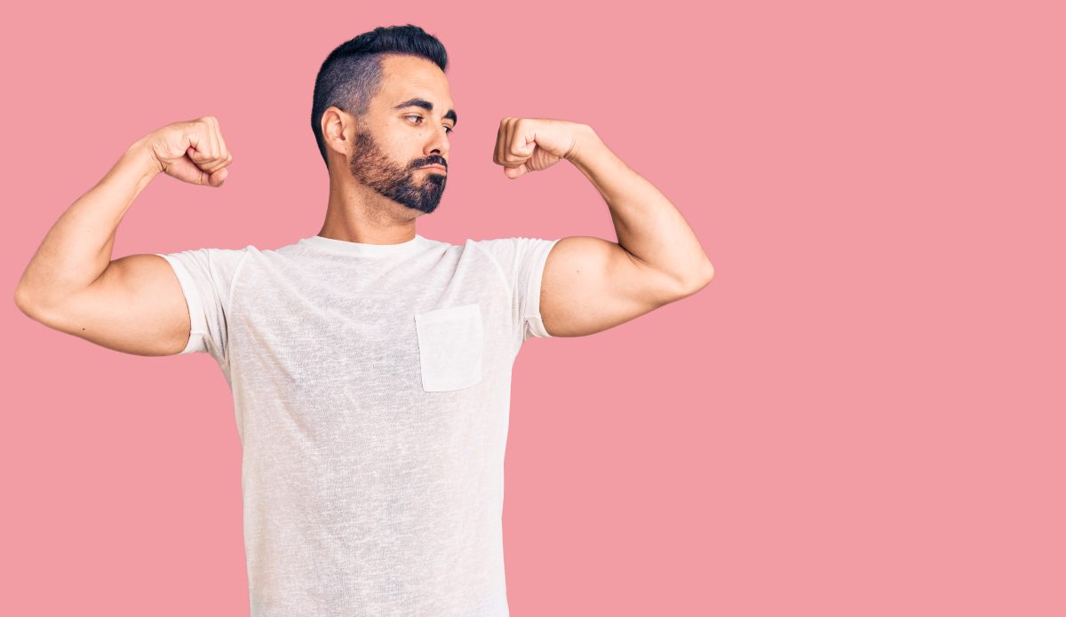 young-hispanic-man-wearing-casual-clothes-showing-arms-muscles-smiling-proud-fitness-concept-1200x695.jpg
